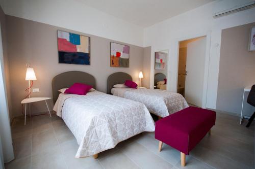 Una cama o camas en una habitación de Daniela B&B Fiera