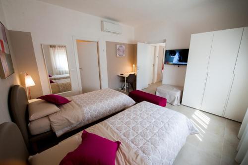 Una cama o camas en una habitación de Daniela B&B Fiera