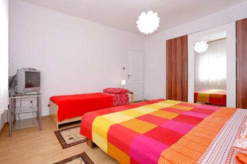 Ένα ή περισσότερα κρεβάτια σε δωμάτιο στο Apartmani Mlinar