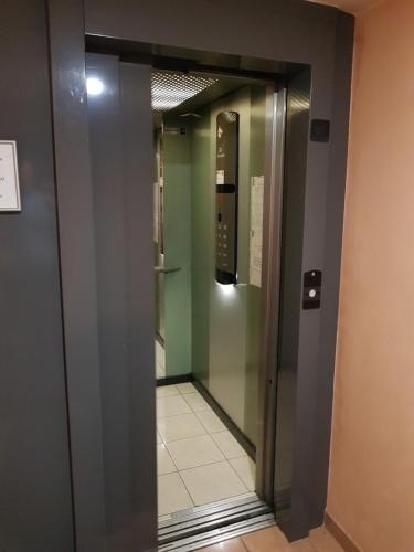 an elevator in a building with a phone at Studio With Swimming Pool 80 meters near the beach in Nice