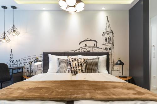 a bedroom with a bed with a black and white wall at Classy Design Accommodation in Zadar
