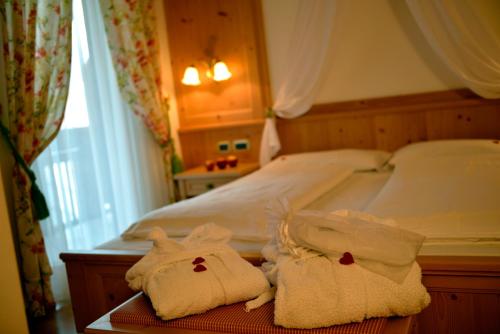 Postel nebo postele na pokoji v ubytování Hotel B&B Andreas