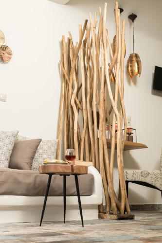 a living room with a couch and a table at Naxos Petite Studios in Agios Prokopios