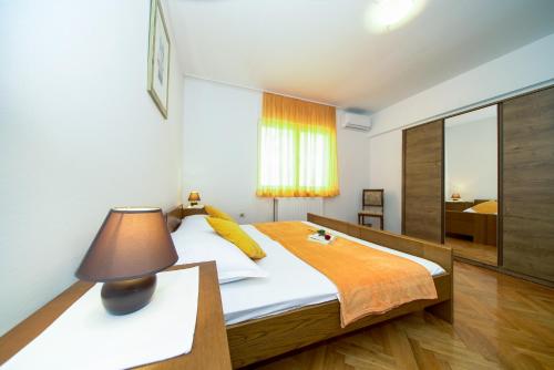 Posteľ alebo postele v izbe v ubytovaní Apartments L&L