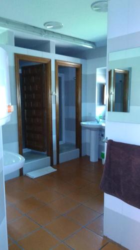 a bathroom with a tub and a toilet and a sink at Las Huellas de Cameros in Soto en Cameros