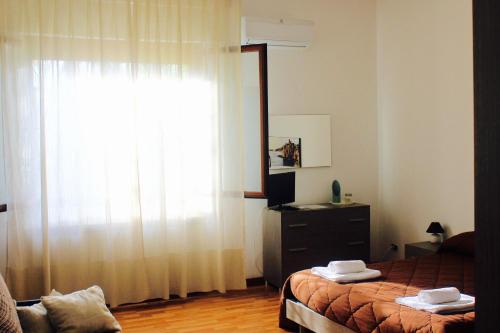 A bed or beds in a room at La Casetta