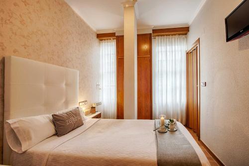 Posteľ alebo postele v izbe v ubytovaní Hostal Zahara
