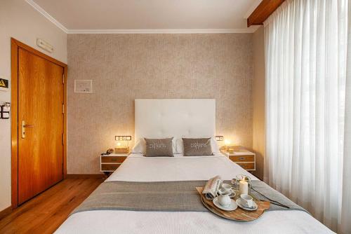 Postel nebo postele na pokoji v ubytování Hostal Zahara