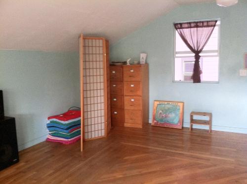 a room with a book shelf and a dresser at Hawaii Tropical Volcano mansion + Sauna in Hilo