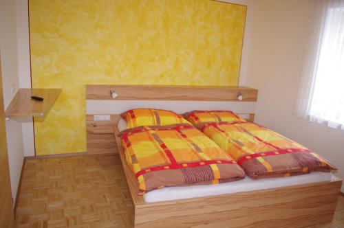 Un pat sau paturi într-o cameră la Ulnhof