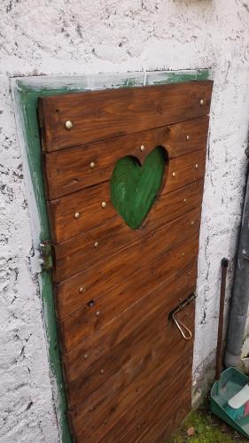 a wooden door with a heart on it at Casa San Francesco in Agnone