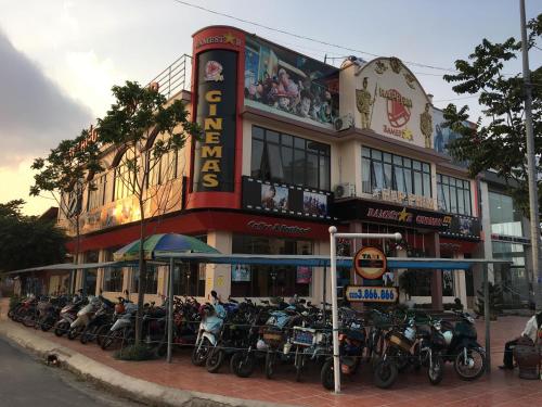 a group of motorcycles parked in front of a building at Chau A Hotel in Hải Dương