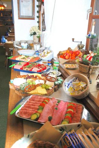a buffet with many different types of food on a table at Landgasthaus Zur Kupferkanne in Kobern-Gondorf