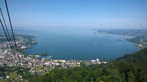 a view of a city and a body of water at F E R I E N W O H N U N G "Am Halbenstein" in Hörbranz