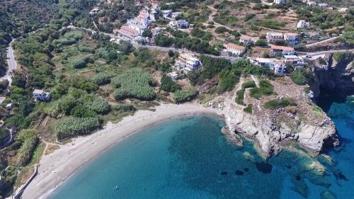an aerial view of a beach and the ocean at Kerame Studios & Apartments in Évdhilos