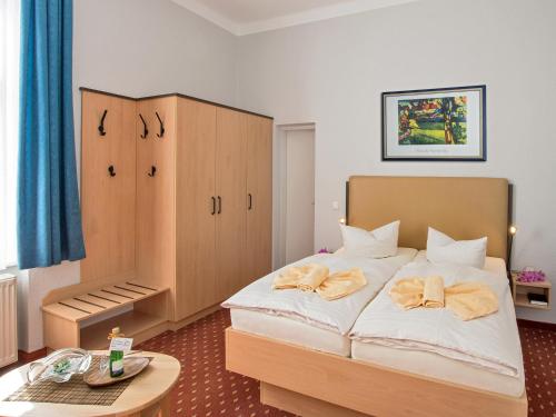 Кровать или кровати в номере Strandvilla Imperator