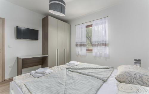 Postel nebo postele na pokoji v ubytování Apartments Katja