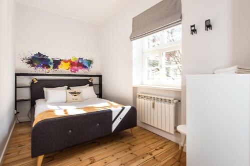 En eller flere senge i et værelse på Bliss Apartments Sydney