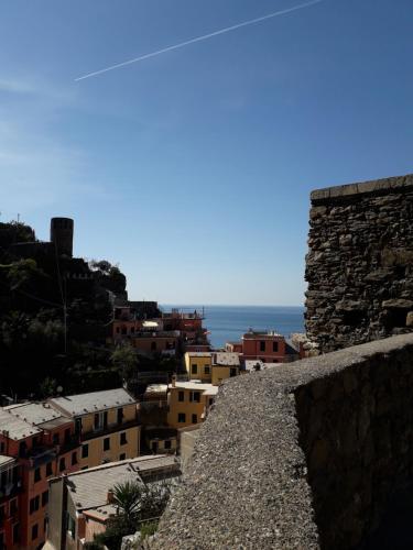 a view of a city from atop a wall at La Scala Vernazza CinqueTerre in Vernazza