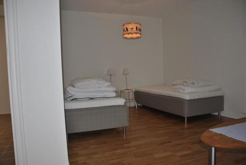 Postel nebo postele na pokoji v ubytování Sjöhuset