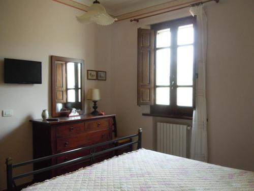Postel nebo postele na pokoji v ubytování Agriturismo Le Carolee