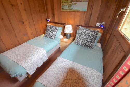 an overhead view of a bedroom with two beds at Dalriada by Loch Goil in Carrick