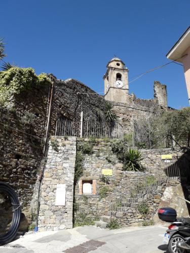 a building with a clock tower on top of it at La Scala Vernazza CinqueTerre in Vernazza