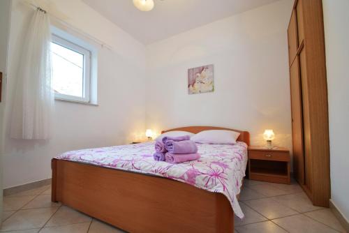 Katil atau katil-katil dalam bilik di APARTMANI 4 PALME