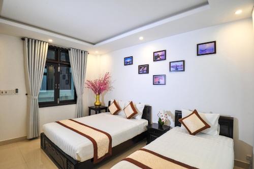 Giường trong phòng chung tại Hoi An Bali Homestay