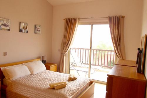 Ένα ή περισσότερα κρεβάτια σε δωμάτιο στο Melanos Village A21