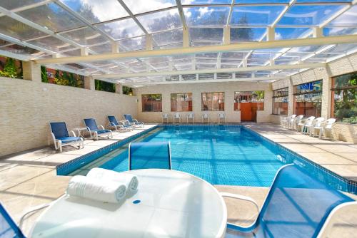 Bazén v ubytování Hotel Refúgio Vista Serrana nebo v jeho okolí