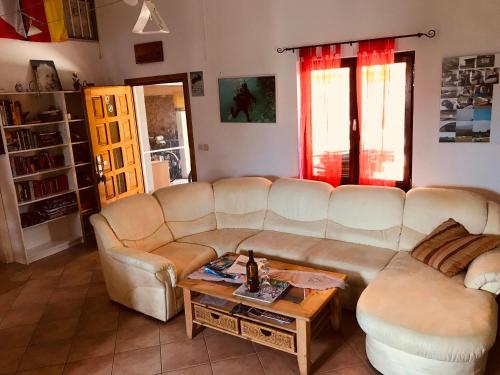 a living room with a couch and a coffee table at Villa AnaAngela in Malinska