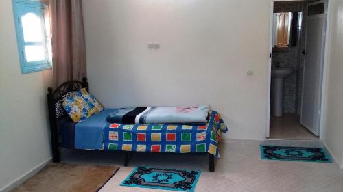 Ein Bett oder Betten in einem Zimmer der Unterkunft Azur Tafraout