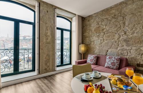 a living room filled with furniture and a window at 296 Heritage Apartments in Vila Nova de Gaia