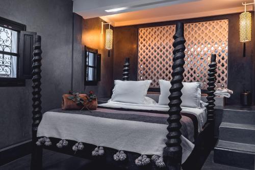 Ambre Epices Medina Riad tesisinde bir odada yatak veya yataklar