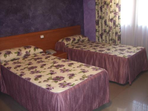 Katil atau katil-katil dalam bilik di Hotel Vadorrey