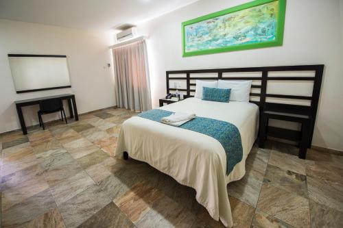 Postel nebo postele na pokoji v ubytování Hotel Andiroba Palace