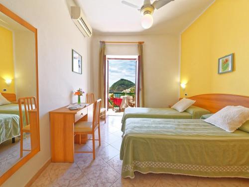 Postel nebo postele na pokoji v ubytování Hotel Villa Franz