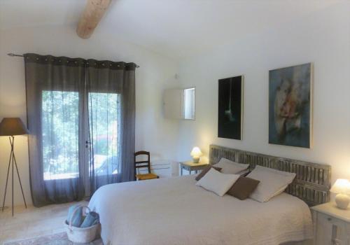Ένα ή περισσότερα κρεβάτια σε δωμάτιο στο Les Terrasses - Gordes