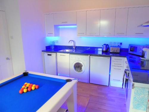 Cucina o angolo cottura di Snug - Tùr Sealladh Apartment