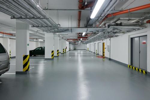 an empty parking garage with cars parked in it at Residence Nad Vltavou in Prague