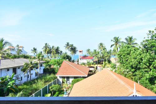 arial view of a resort with palm trees and buildings at Thambili Cabanas in Hikkaduwa