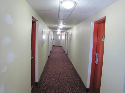 a hallway of an office building with a long corridor at Valley Inn Motel in Sudbury