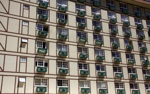 a facade of a building with lots of windows at Estudio Itaipava in Itaipava