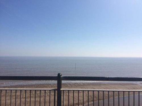 a view of a beach with a fence and the ocean at The Laurels Hotel in Skegness