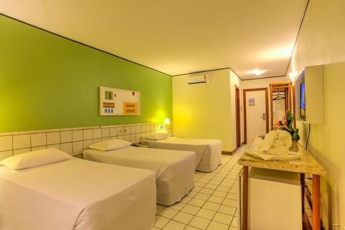 Postel nebo postele na pokoji v ubytování Hotel Aldeia da Praia