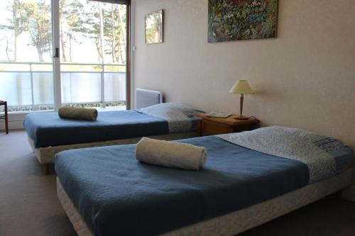 Кровать или кровати в номере Saint Philibert à 2 pas de la mer