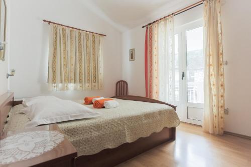 Łóżko lub łóżka w pokoju w obiekcie Apartments Goic