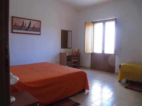 Ένα ή περισσότερα κρεβάτια σε δωμάτιο στο Agriturismo Torre Del Golfo