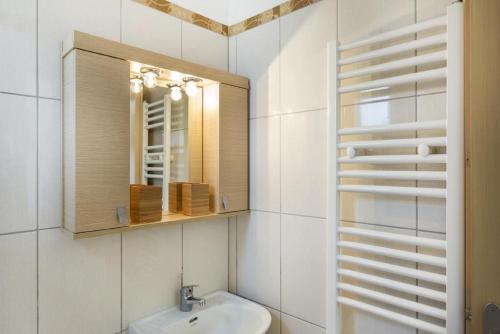 a bathroom with a sink and a mirror at Grand View Villa in Kardamaina